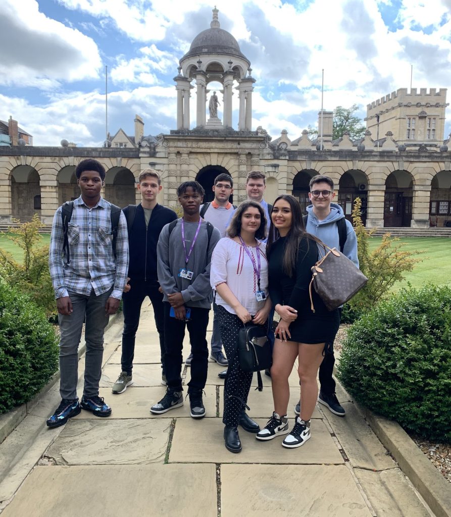 Eight Post-16 students are photographed for the camera during a school trip to The Queen's College in Oxford.
