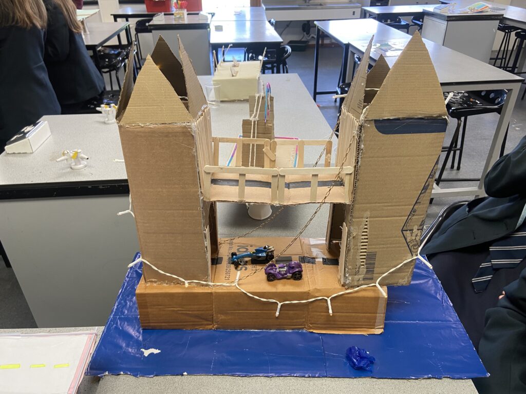 A photo of a bridge built by students during Science Week at the academy.