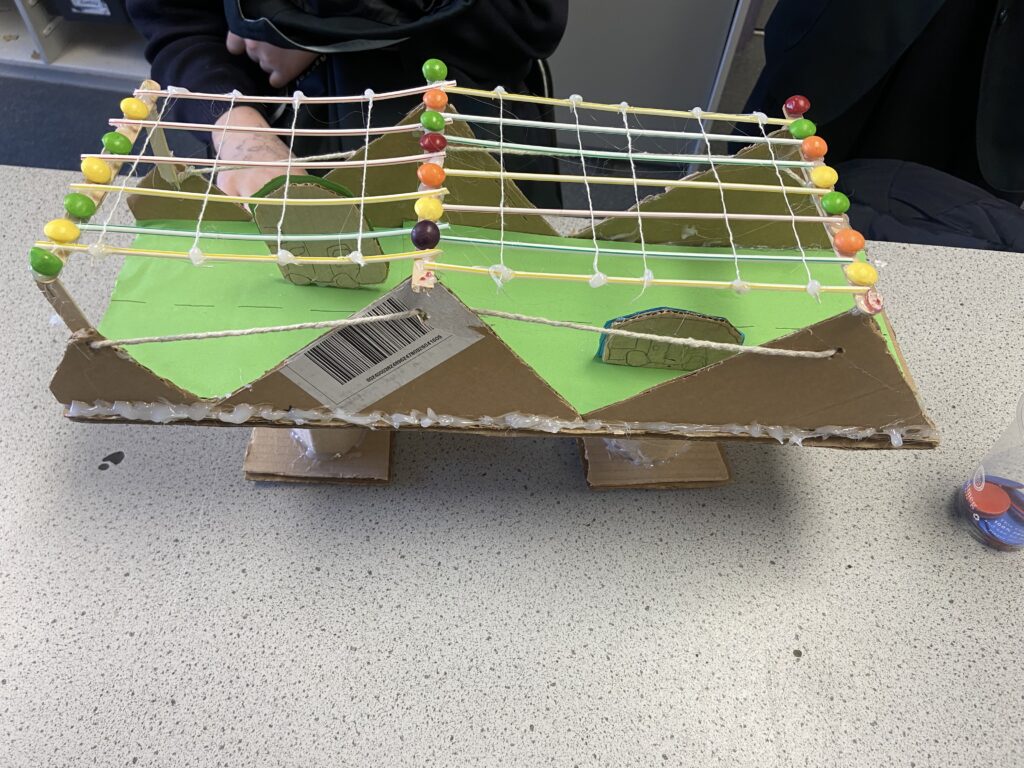 A photo of a bridge built by students during Science Week at the academy.