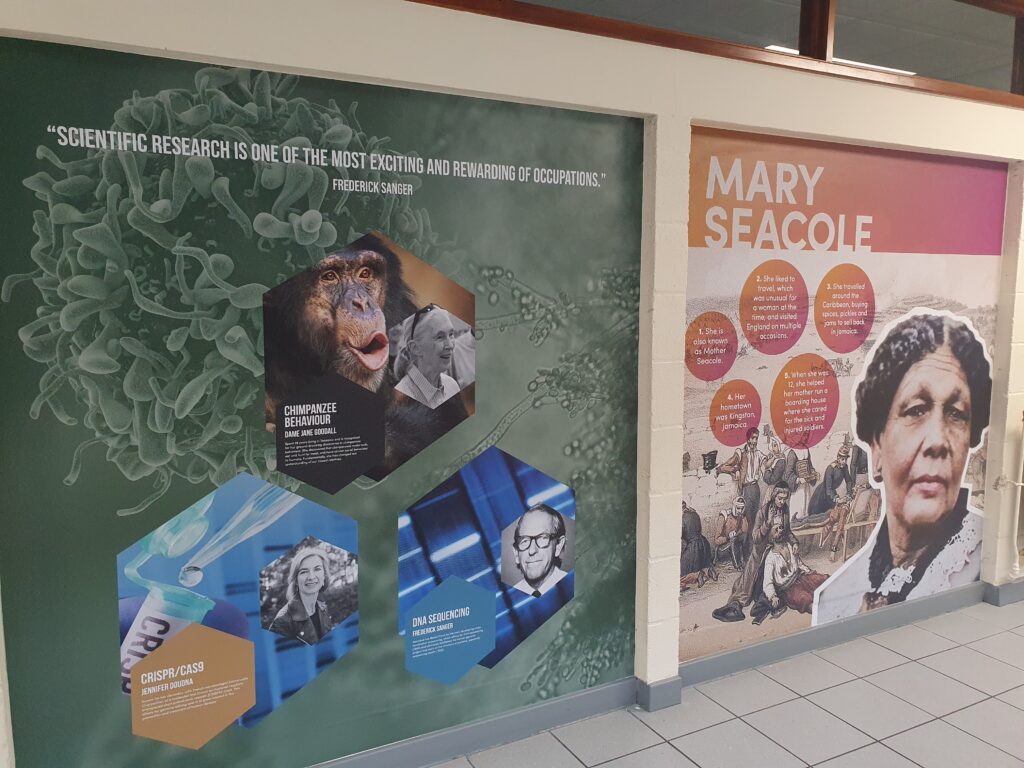 Photo showing a corridor inside the Ebbsfleet Academy building, featuring information and images of famous Scientists and the British Nurse.