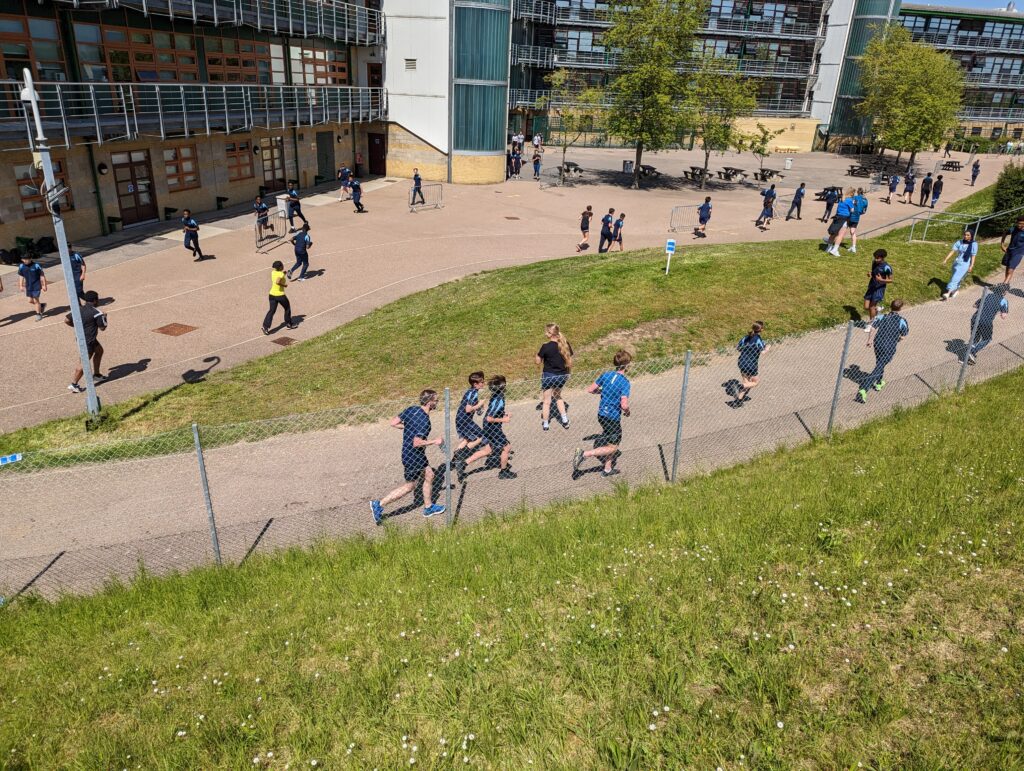 An aerial shot of students running