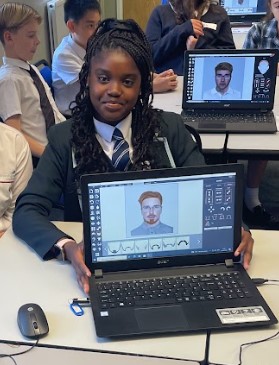 Year 8 student showing off their work on a computer