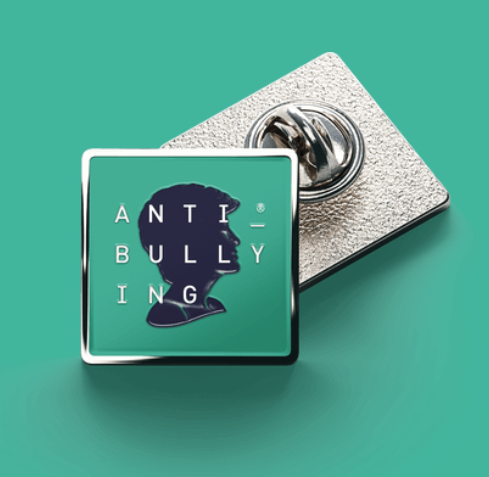 A photo showing two badges from the Diana Awards featuring the words 'Anti-Bullying' against a silhouette of the face of Diana, Princess of Wales.