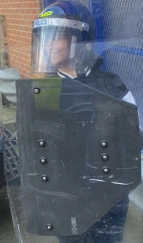 Student stood in tactical gear at a Met Police event