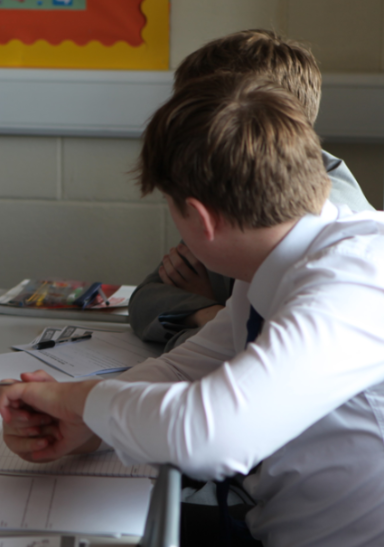 A Level student sat talking to another student