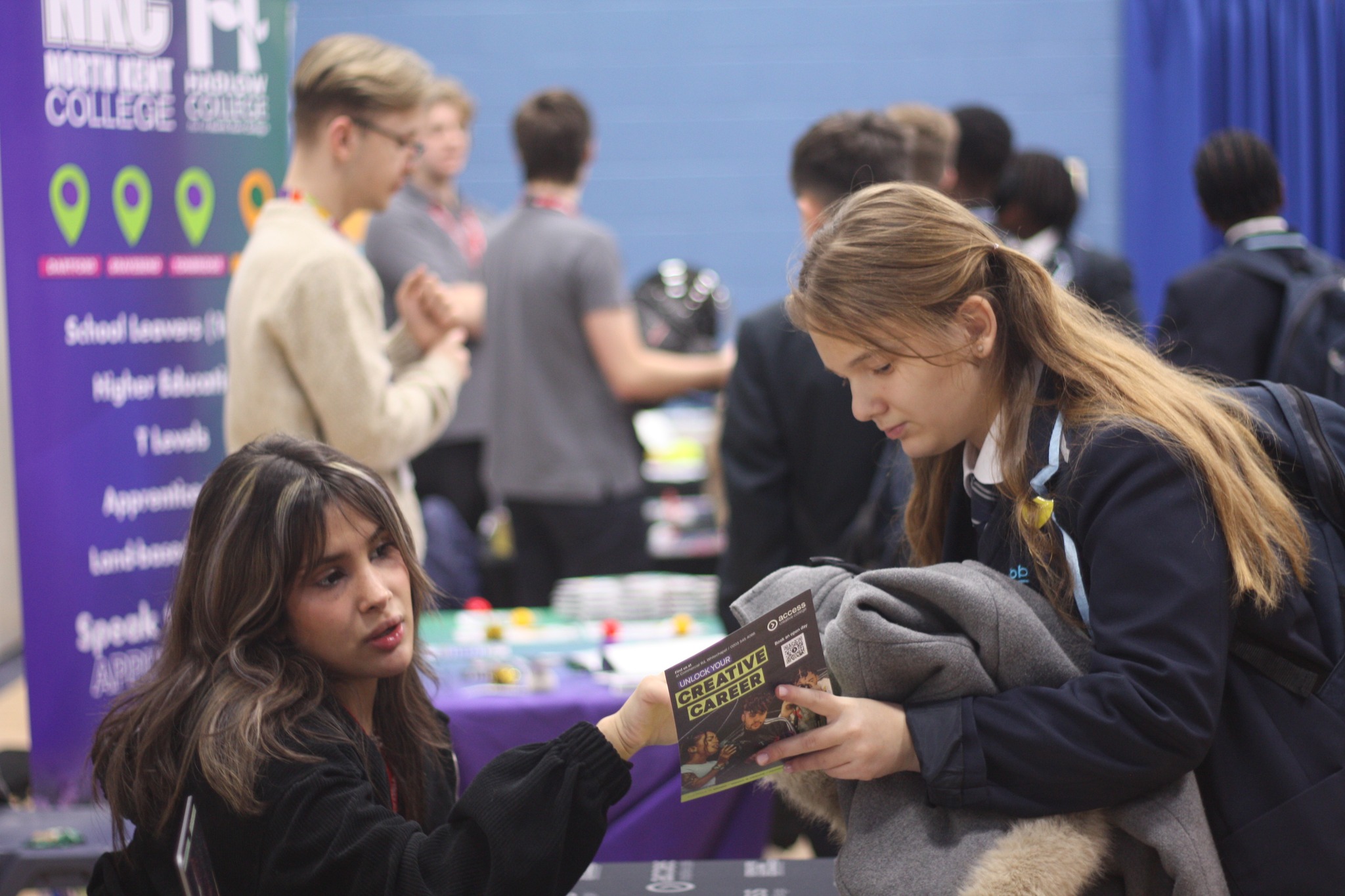 Two students looking at a leaflet